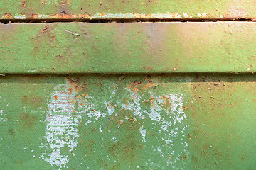 Image showing Horizontal old green rusty metal door background