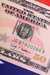 Image showing fifty dollar bill in front of the American flag