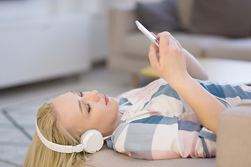 Image showing girl enjoying music through headphones