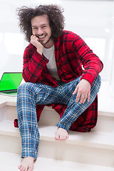 Image showing freelancer in bathrobe working from home