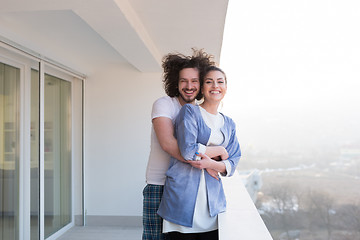 Image showing Couple hugging on the balcony