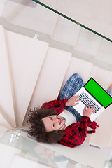 Image showing freelancer in bathrobe working from home