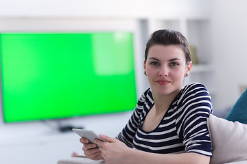 Image showing woman on sofa using tablet computer