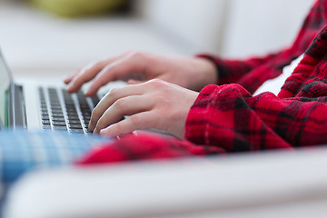 Image showing man freelancer in bathrobe working from home