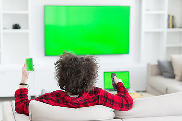 Image showing young man in bathrobe enjoying free time