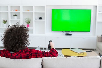 Image showing young man in bathrobe enjoying free time