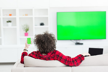 Image showing young man in bathrobe enjoying free time