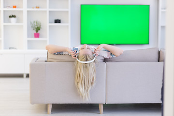 Image showing girl enjoying music through headphones