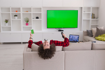 Image showing young man in bathrobe enjoying free time