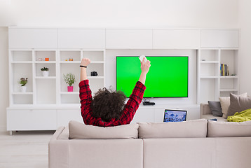 Image showing young man in bathrobe enjoying free time