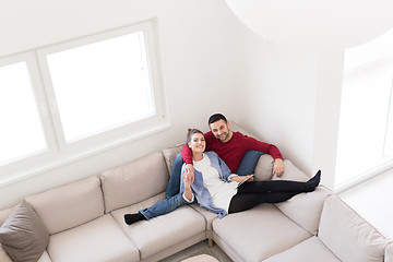 Image showing couple relaxing at  home with tablet computers