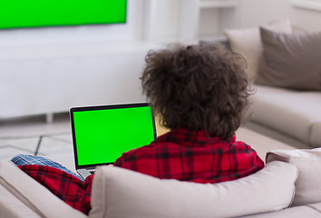 Image showing man freelancer in bathrobe working from home