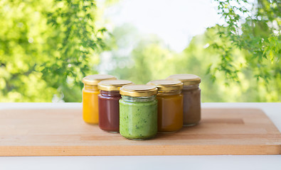 Image showing vegetable or fruit puree or baby food in jars