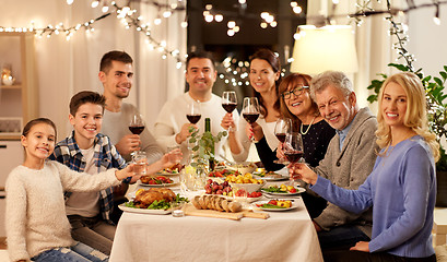 Image showing happy family having dinner party at home