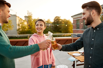 Image showing friends toast drinks at barbecue party on rooftop