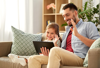 Image showing father and daughter having video call on tablet pc