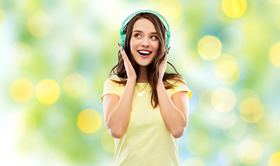 Image showing happy young woman or teenage girl with headphones