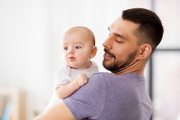 Image showing father with little baby girl at home