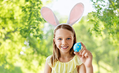 Image showing happy girl with colored easter egg