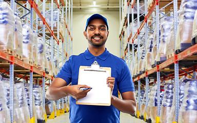 Image showing delivery man or warehouse worker with clipboard