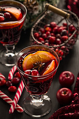 Image showing Hot cranberry mulled wine with oranges, anise and cinnamon