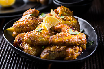 Image showing Spicy chicken wings with garlic and lemon marinade