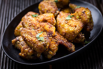 Image showing Spicy chicken wings with garlic and lemon marinade