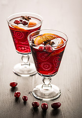 Image showing Hot cranberry mulled wine with oranges, anise and cinnamon