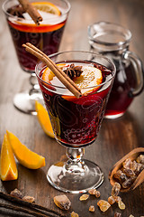 Image showing Hot cranberry mulled wine with oranges, anise and cinnamon