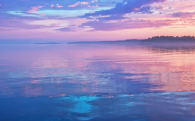 Image showing Misty Lilac Sunset Seascape With Sky Reflection