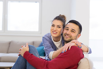 Image showing couple hugging and relaxing on sofa