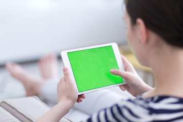 Image showing woman on sofa using tablet computer