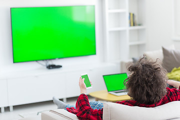 Image showing young man in bathrobe enjoying free time