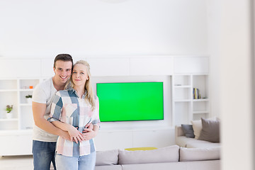 Image showing couple hugging in their new home