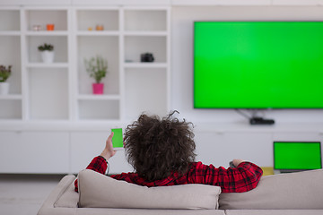 Image showing young man in bathrobe enjoying free time