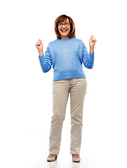 Image showing portrait of happy senior woman celebrating triumph