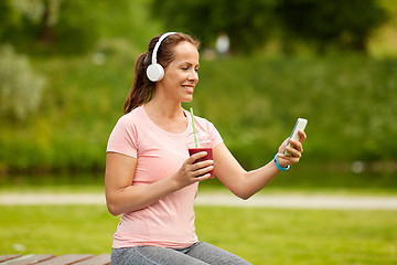 Image showing woman with smartphone and shake listening to music