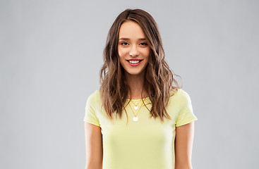 Image showing young woman or teenage girl in yellow t-shirt