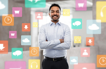 Image showing indian businessman with app icons at office