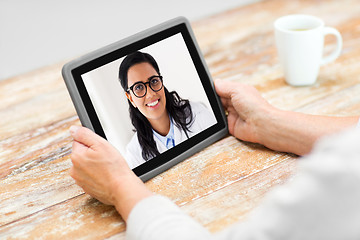 Image showing senior woman patient having video call with doctor