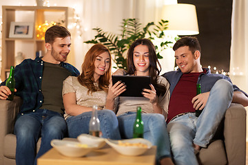 Image showing friends with tablet computer drinking beer at home