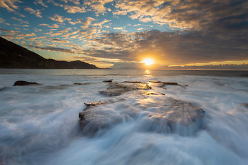 Image showing Tidal waves cascading over the rocky coastline at Coalcliff Aust