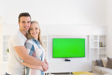 Image showing couple hugging in their new home