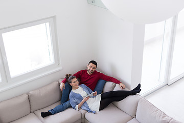 Image showing couple relaxing at  home with tablet computers