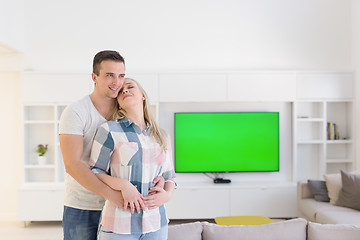 Image showing couple hugging in their new home