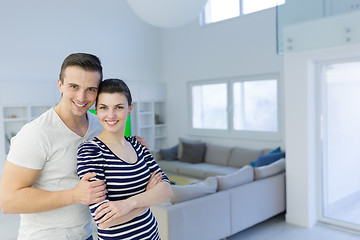 Image showing couple hugging in their new home