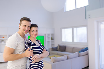 Image showing couple hugging in their new home