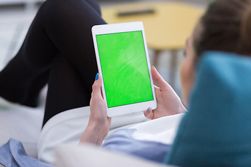 Image showing woman on sofa using tablet computer