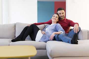 Image showing couple hugging and relaxing on sofa