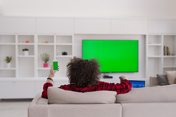 Image showing young man in bathrobe enjoying free time